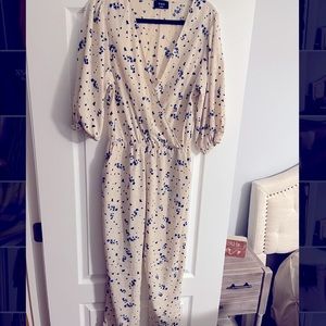VICI NEW WITHOUT TAGS- off white jumpsuit with royal blue flowers.
